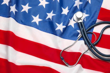 Stethoscope on USA flag, top view. Health care concept