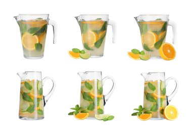 Serinletici narenciye dolu cam sürahiler beyaz ve sette izole edilmiş.