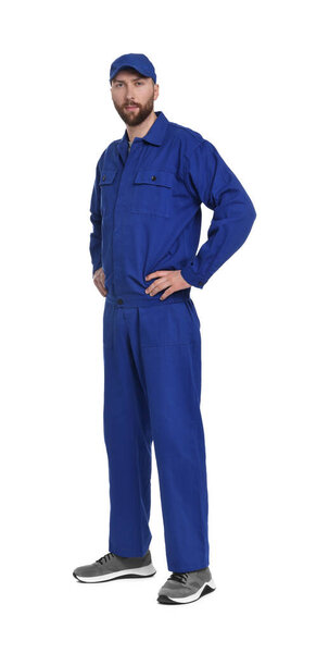 Professional auto mechanic in blue uniform on white background