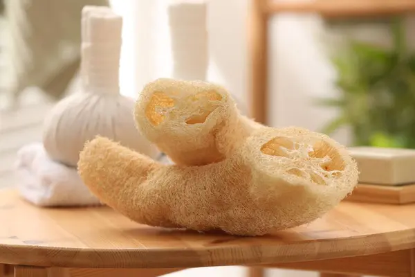 stock image Loofah sponges on wooden table indoors, closeup