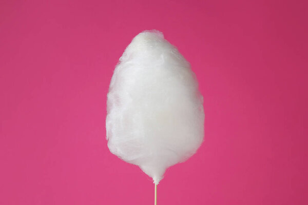 One sweet cotton candy on pink background