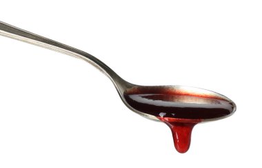 Tatlı reçelli kaşık beyaz üzerine izole