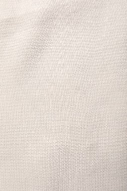 Arkaplan olarak bej kumaşın dokusu, üst görünüm