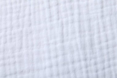 Arkaplan olarak beyaz kumaşın dokusu, üst görünüm