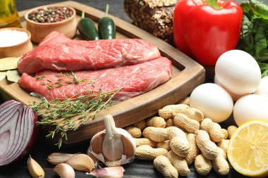 Fresh meat and other products for balanced diet on table