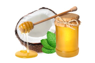 Hindistan cevizi, ahşap kaplama ve ballı kavanoz beyaza izole edilmiş.