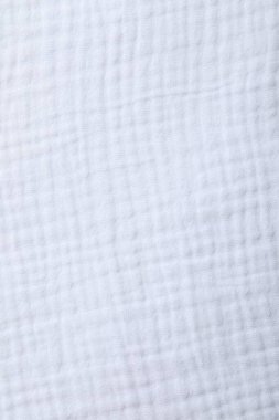 Arkaplan olarak beyaz kumaşın dokusu, üst görünüm