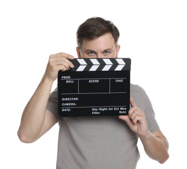 Making movie. Man with clapperboard on white background