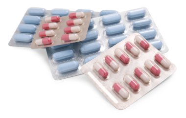 Kabarcıklardaki farklı antibiyotik hapları beyaza izole edilmiş.