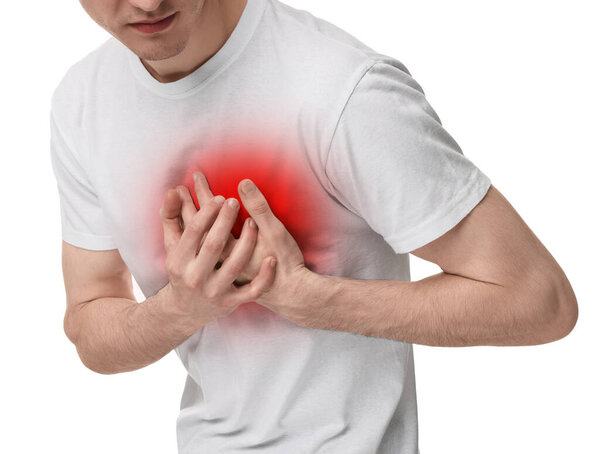 Man suffering from pain in chest on white background, closeup. Heart disease