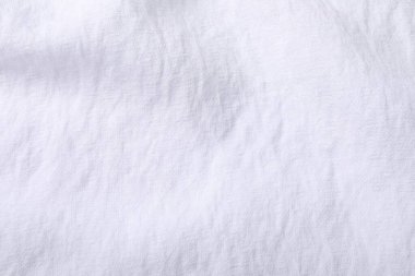 Arkaplan olarak beyaz kumaşın dokusu, üst görünüm