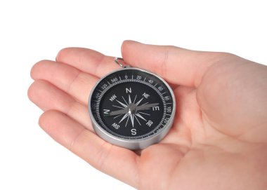 Woman holding compass on white background, closeup