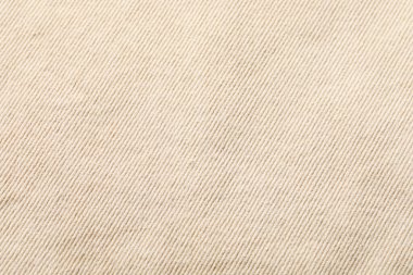 Arkaplan olarak bej kumaşın dokusu, yakın plan