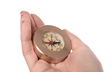 Woman holding compass on white background, closeup