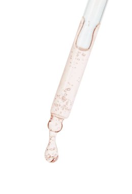 Beyaz arka planda turuncu kozmetik yağlı damlatıcı