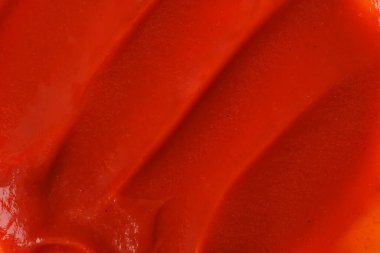 Arka plan olarak ketçap dokusu, üst görünüm. Domates sosu.