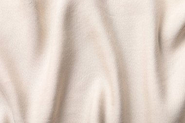 Arkaplan olarak bej kumaşın dokusu, üst görünüm