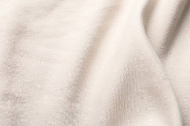 Arkaplan olarak bej kumaşın dokusu, üst görünüm