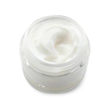 Beyaz kavanozdaki yüz kremi.