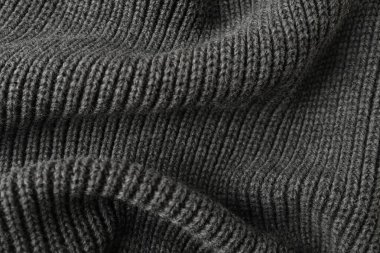 Arka plan olarak gri örülmüş kumaş dokusu, üst görünüm