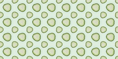 Açık yeşil zemin üzerinde yuvarlak salatalık dilimleri, desen tasarımı