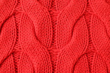 Arka plan olarak kırmızı örülmüş kumaşın dokusu, üst görünüm