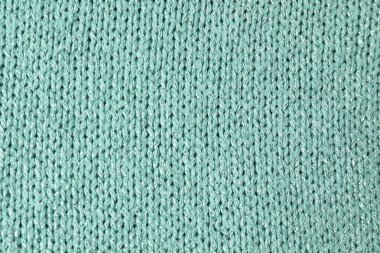 Arka plan olarak turkuaz örülmüş kumaş dokusu, üst görünüm