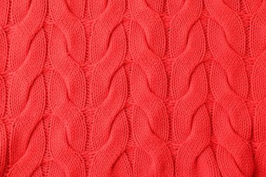 Arka plan olarak kırmızı örülmüş kumaşın dokusu, üst görünüm