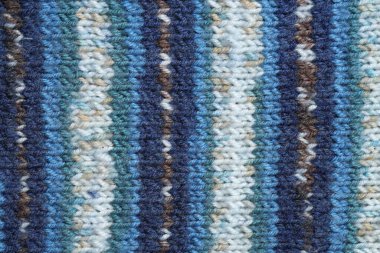 Arka plan olarak renkli örülmüş kumaşın dokusu, üst görünüm