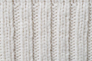 Arka plan olarak beyaz örülmüş kumaşın dokusu, üst görünüm