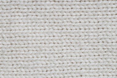Arka plan olarak beyaz örülmüş kumaşın dokusu, üst görünüm