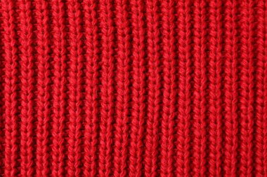 Arka plan olarak kırmızı örülmüş kumaşın dokusu, üst görünüm