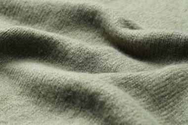 Arka plan olarak zeytin örgü kumaş dokusu, yakın plan