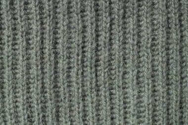 Arka plan olarak gri örülmüş kumaş dokusu, üst görünüm