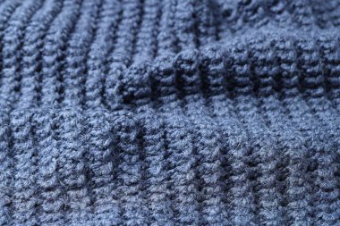 Arka plan olarak mavi örülmüş kumaş dokusu, yakın plan