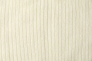 Arka plan olarak beyaz örülmüş kumaşın dokusu, üst görünüm