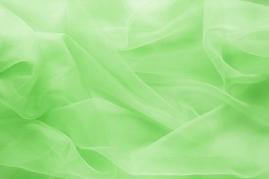 Güzel açık yeşil tül, kumaşın yakın görüntüsü.