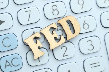 Word Fed (Federal Reserve System) made with letters on calculator, top view clipart