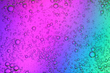 Renk arkaplanında yağ kabarcıkları, makro görünüm. Kozmetik ürünü