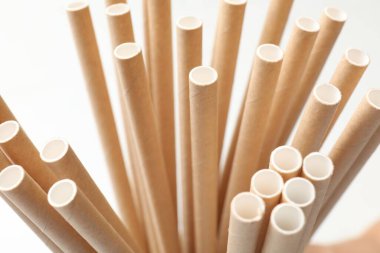 Many bamboo drinking straws on white background, closeup clipart