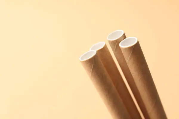 stock image Bamboo drinking straws on beige background, closeup. Space for text