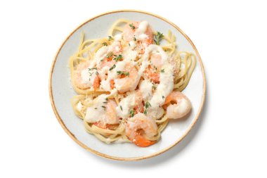 Tasty pasta with shrimps, creamy sauce and cheese isolated on white, top view