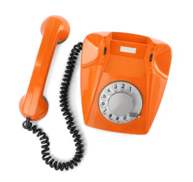 Döner kadranlı eski turuncu telefon beyaz, üst görünümde izole.