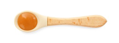 Lezzetli bebek mamasıyla bembeyaz bir kaşık.