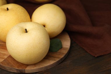 Delicious fresh apple pears on wooden table, closeup clipart