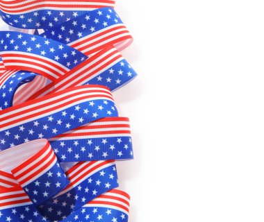 Ribbon in colors of American flag isolated on white, top view clipart