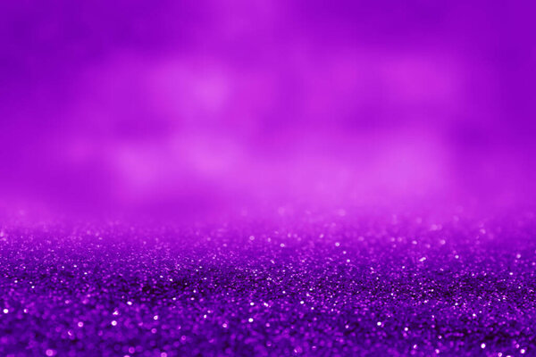 Shiny violet glitter, closeup. Halloween background, banner design
