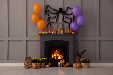 Room with fireplace decorated for Halloween. Festive interior