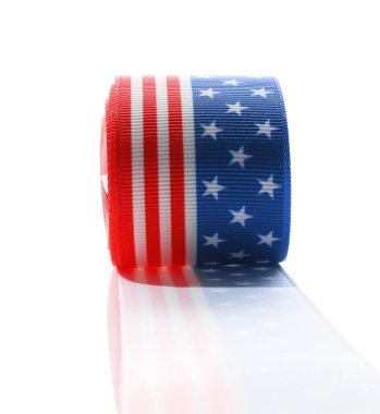 Roll with ribbon in colors of American flag isolated on white clipart