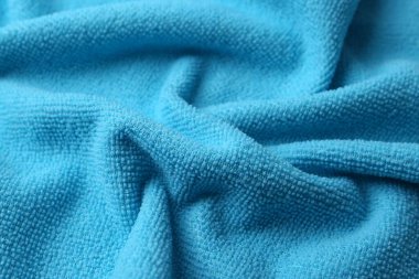 Temiz açık mavi mikrofiber kumaş arka plan olarak, yakın plan